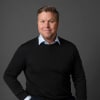 En profilbild av fastighetsmäklare Björn Petrén