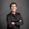 En profilbild av fastighetsmäklare Anna Rahm