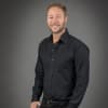 En profilbild av fastighetsmäklare Kristian Sundberg