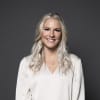 En profilbild av fastighetsmäklare Melanie Johansson