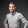 En profilbild av fastighetsmäklare David Moberg