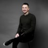 En profilbild av fastighetsmäklare Emir Cosovic