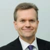 En profilbild av fastighetsmäklare Anders Edmark