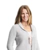 En profilbild av fastighetsmäklare Sofia Erlandsdotter Dinneny