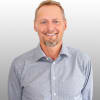 En profilbild av fastighetsmäklare Jörgen Andersson