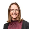 En profilbild av fastighetsmäklare Anna Norman