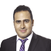 En profilbild av fastighetsmäklare Andreas Yacoub