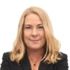 En profilbild av fastighetsmäklare Marina Bergman