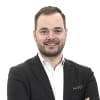 En profilbild av fastighetsmäklare Niklas Appelbrant