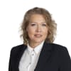 En profilbild av fastighetsmäklare Sandra Magneréus
