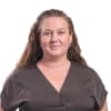En profilbild av fastighetsmäklare Sandra Tidblom