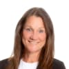 En profilbild av fastighetsmäklare Christina Marktin