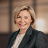 En profilbild av fastighetsmäklare Anna Hellgren