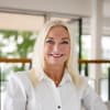 En profilbild av fastighetsmäklare Helena Ullhag