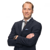 En profilbild av fastighetsmäklare Alexander Helin