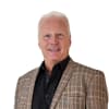 En profilbild av fastighetsmäklare Ulf Sjöholm