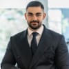En profilbild av fastighetsmäklare George El Ashkar