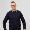 En profilbild av fastighetsmäklare Fredrik Pargéus