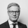 En profilbild av fastighetsmäklare Eric Melkersson