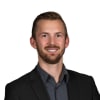En profilbild av fastighetsmäklare Linus Thor