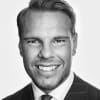 En profilbild av fastighetsmäklare Jesper Karlsson