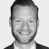 En profilbild av fastighetsmäklare Erik Dahlgren