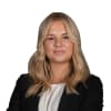 En profilbild av fastighetsmäklare Linda Richardson