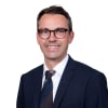 En profilbild av fastighetsmäklare Kristoffer Jansson