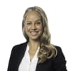 En profilbild av fastighetsmäklare Mia Mörner