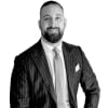 En profilbild av fastighetsmäklare Haris Velic
