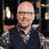 En profilbild av fastighetsmäklare Joachim Carlstedt