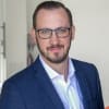 En profilbild av fastighetsmäklare Yngve Qvarnström