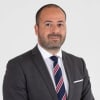 En profilbild av fastighetsmäklare Jacob Hanna