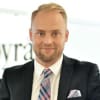 En profilbild av fastighetsmäklare Krister Florin