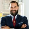 En profilbild av fastighetsmäklare Robert Ljungström
