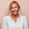 En profilbild av fastighetsmäklare Johanna Nyström