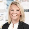 En profilbild av fastighetsmäklare Diana Kristensen