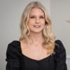 En profilbild av fastighetsmäklare Frida Rundberg