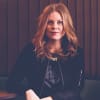 En profilbild av fastighetsmäklare Elaine Mürgas