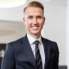 En profilbild av fastighetsmäklare Marcus Sundberg
