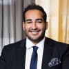En profilbild av fastighetsmäklare Ejmen Japar