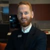 En profilbild av fastighetsmäklare Marcus Eriksson