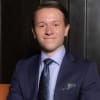 En profilbild av fastighetsmäklare Marko Karlsson