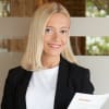 En profilbild av fastighetsmäklare Linda Shala