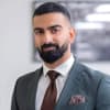 En profilbild av fastighetsmäklare Marvin Yousif