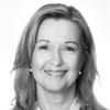 En profilbild av fastighetsmäklare Lena Wiklund