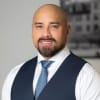 En profilbild av fastighetsmäklare Maximillian Broman