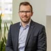 En profilbild av fastighetsmäklare Olle Löfberg