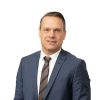 En profilbild av fastighetsmäklare Andreas Wallin