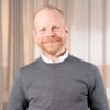 En profilbild av fastighetsmäklare Niclas Andersson